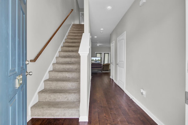 entrance foyer with dark hardwood / wood-style flooring