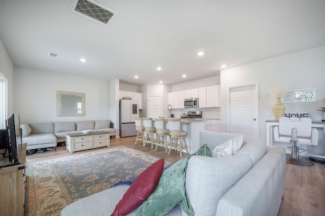 452 Minim St, Charleston, SC 29414 - living area with light wood finished floors and recessed lighting