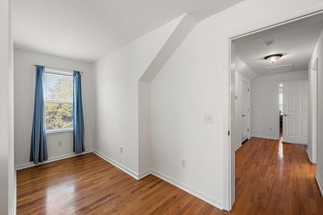 bonus room with wood-type flooring