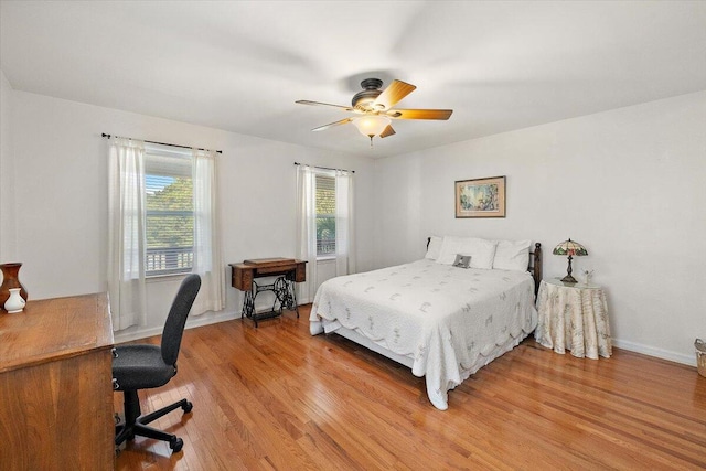 bedroom with wood-type flooring and ceiling fan