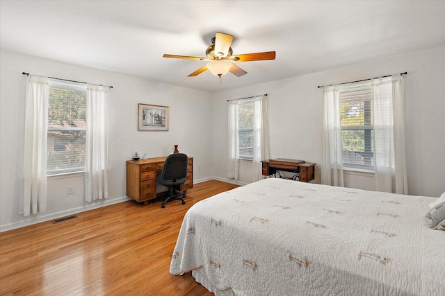 bedroom featuring hardwood / wood-style floors and ceiling fan