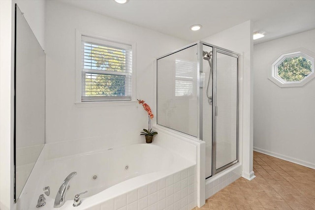 bathroom featuring plenty of natural light, tile patterned floors, and separate shower and tub