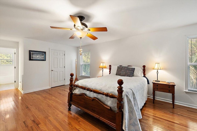 bedroom with wood-type flooring and ceiling fan