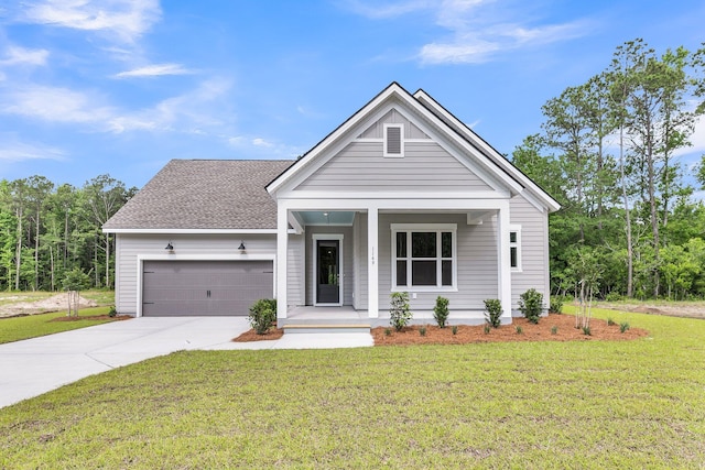 1149 Reserve Ln, Awendaw, SC 29429 - view of front of home with covered porch, a garage, concrete driveway, and a front yard