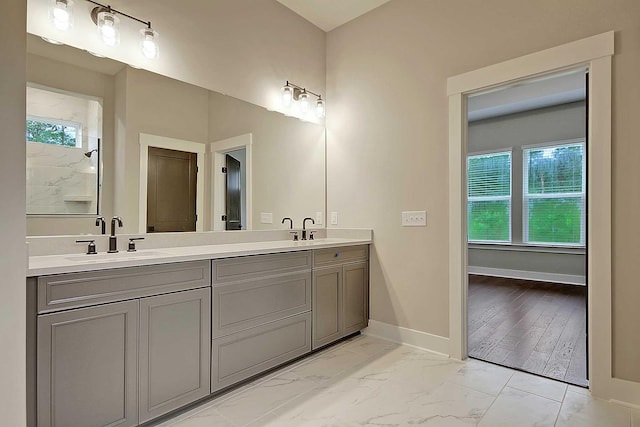 bathroom with vanity and plenty of natural light