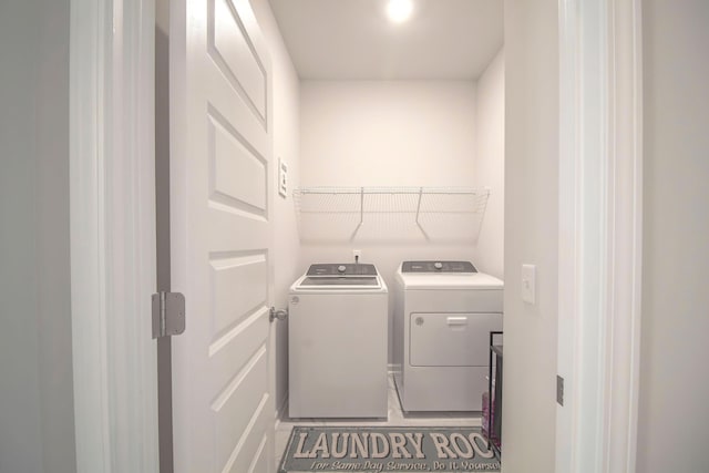 laundry room featuring laundry area and washer and clothes dryer