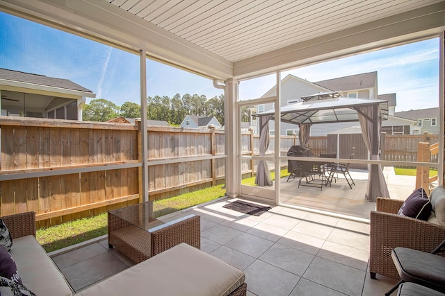 sunroom with outdoor dining space