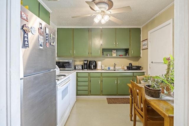 2703 Phyllis St, North Charleston, SC 29405 - kitchen with appliances with stainless steel finishes, a sink, green cabinets, a ceiling fan, and a textured ceiling