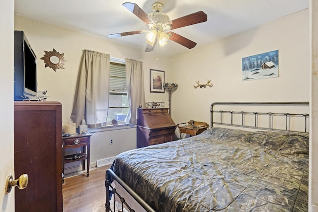 2703 Phyllis St, North Charleston, SC 29405 - bedroom featuring ornamental molding, wood finished floors, baseboards, ceiling fan, and a textured ceiling