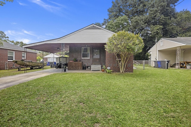 2703 Phyllis St, North Charleston, SC 29405 - view of front facade featuring entry steps, an attached carport, driveway, and brick siding