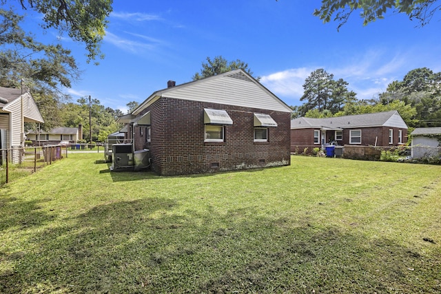 2703 Phyllis St, North Charleston, SC 29405 - rear view of house featuring crawl space, brick siding, and a chimney