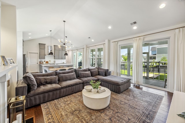 living area with lofted ceiling, dark wood-style floors, plenty of natural light, and recessed lighting