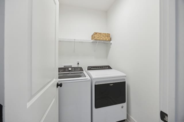 laundry room featuring washing machine and dryer