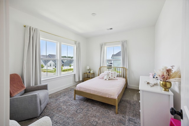 bedroom featuring baseboards