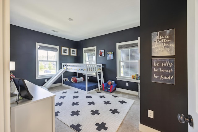 bedroom with carpet flooring and baseboards