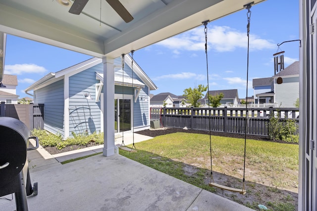 view of patio / terrace featuring a ceiling fan, a residential view, and grilling area
