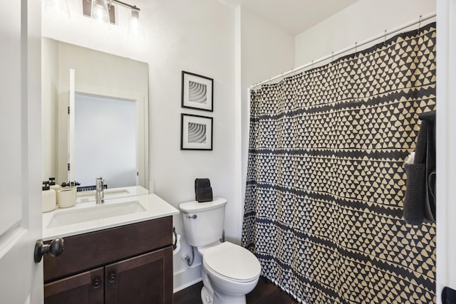 bathroom with vanity, toilet, and a shower with curtain