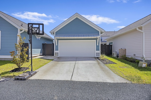 single story home featuring concrete driveway, an attached garage, and fence
