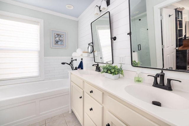full bath featuring a sink, tile patterned flooring, a shower stall, and a bath