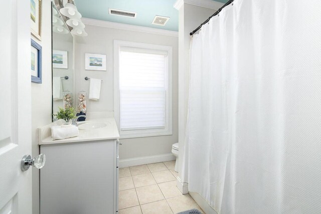 bathroom featuring toilet, vanity, ornamental molding, visible vents, and tile patterned floors