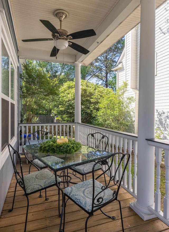 balcony featuring ceiling fan and outdoor dining space