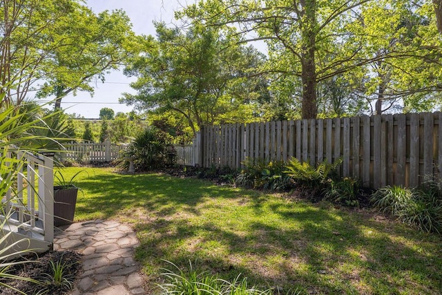 view of yard with a fenced backyard