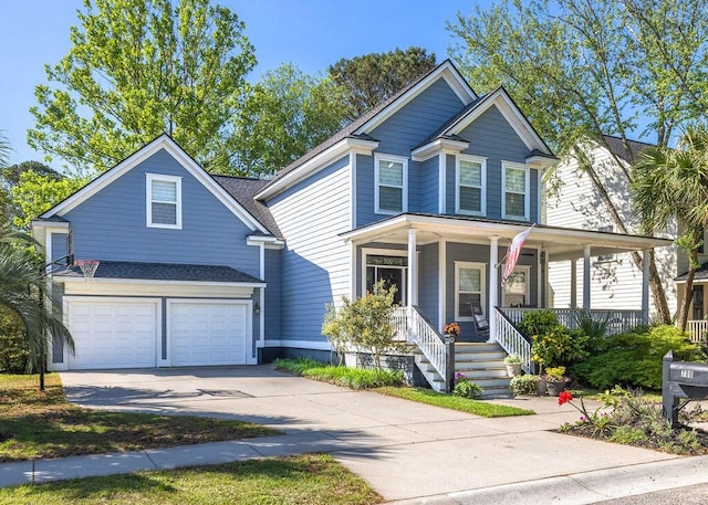 view of front of property featuring covered porch, concrete driveway, an attached garage, and a shingled roof