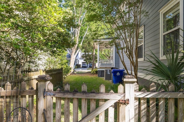 view of side of home featuring fence