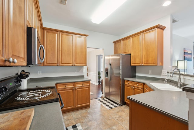 kitchen with appliances with stainless steel finishes and sink