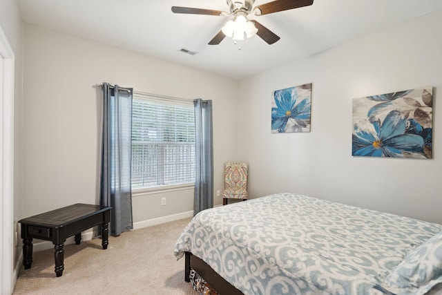 bedroom featuring ceiling fan and light colored carpet