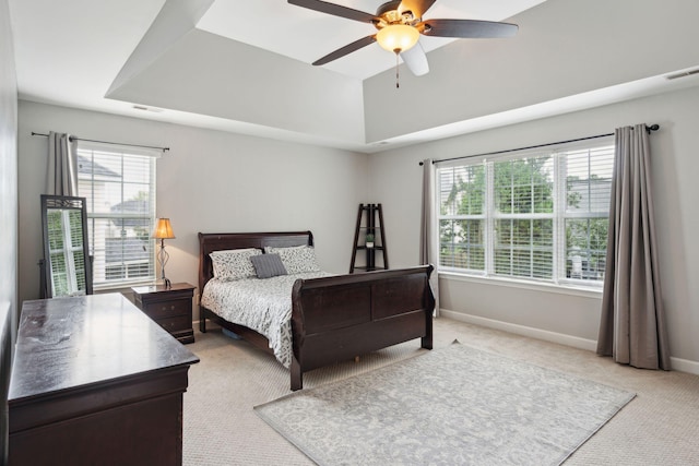 bedroom with ceiling fan and light colored carpet