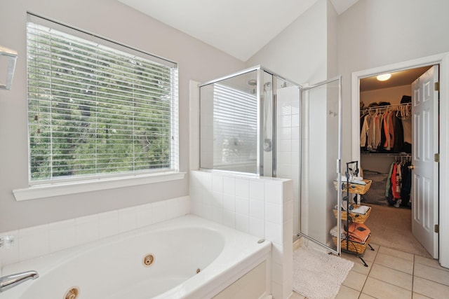 bathroom with tile patterned flooring and separate shower and tub