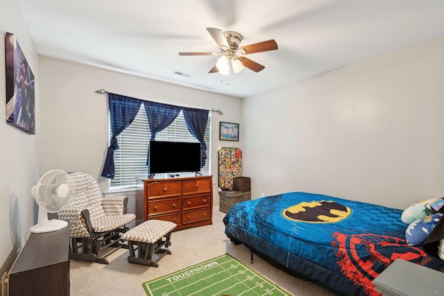 bedroom with ceiling fan and carpet floors