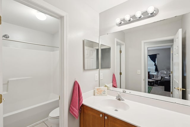 full bathroom with tub / shower combination, vanity, toilet, and tile patterned floors