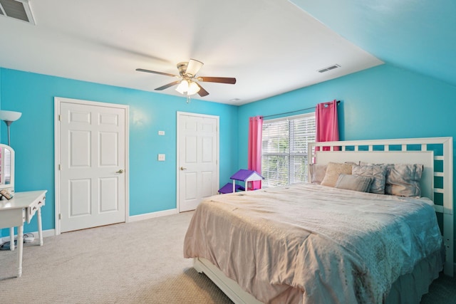 bedroom featuring lofted ceiling, ceiling fan, and light colored carpet