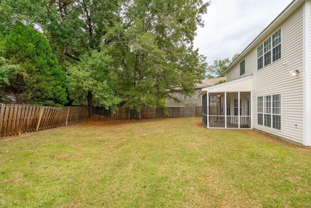 view of yard with a sunroom