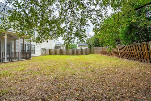 view of yard with ceiling fan