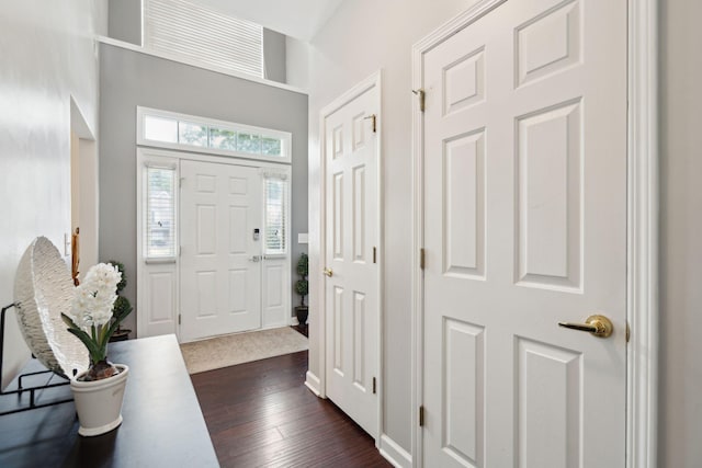 entrance foyer featuring dark hardwood / wood-style floors