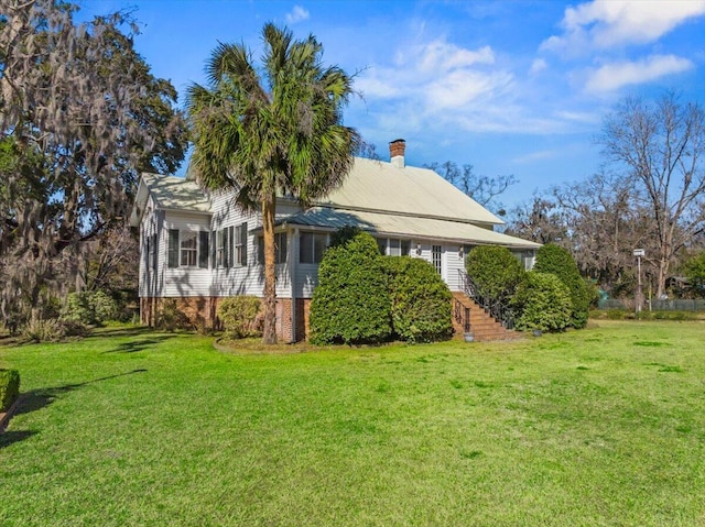 view of property exterior featuring a lawn