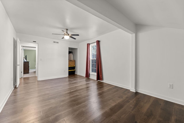 unfurnished living room with visible vents, baseboards, ceiling fan, and dark wood-style flooring