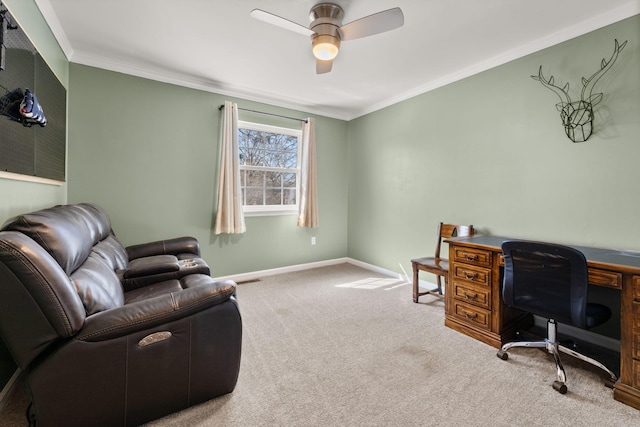 carpeted office space with baseboards, crown molding, and ceiling fan