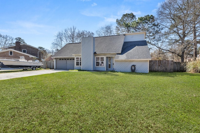 view of front of home with concrete driveway, roof with shingles, a front yard, and fence