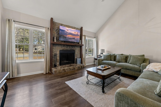 living room featuring a fireplace, wood finished floors, baseboards, and high vaulted ceiling