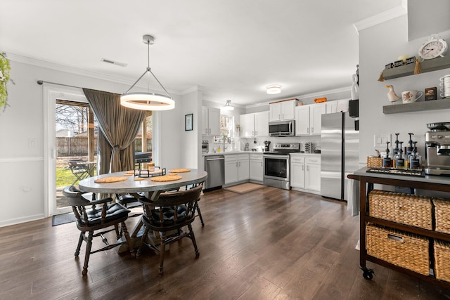 dining space featuring visible vents, baseboards, dark wood-type flooring, and ornamental molding