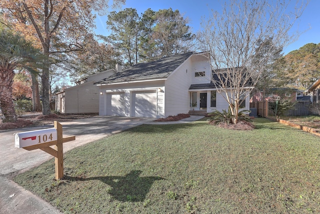 view of front of home featuring a front yard and a garage