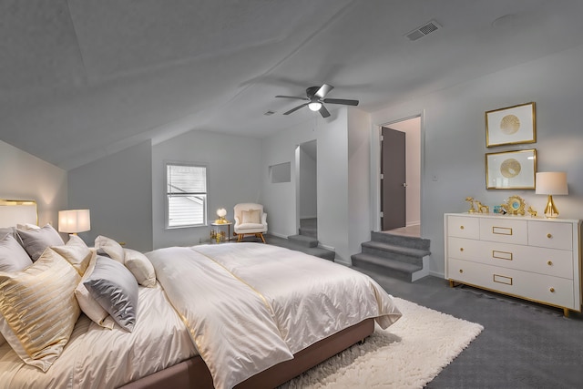 carpeted bedroom featuring ceiling fan and lofted ceiling