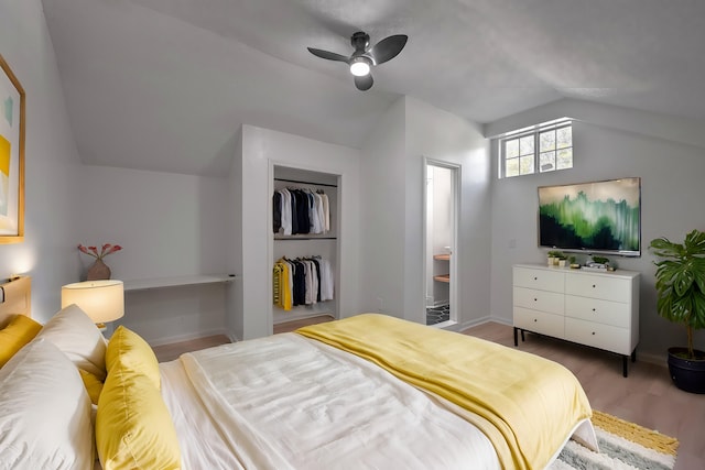 bedroom featuring ceiling fan, a closet, vaulted ceiling, and hardwood / wood-style flooring