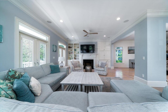 764 Post Oak Dr, Mount Pleasant, SC 29464 - living room with a fireplace, wood finished floors, a ceiling fan, recessed lighting, and crown molding