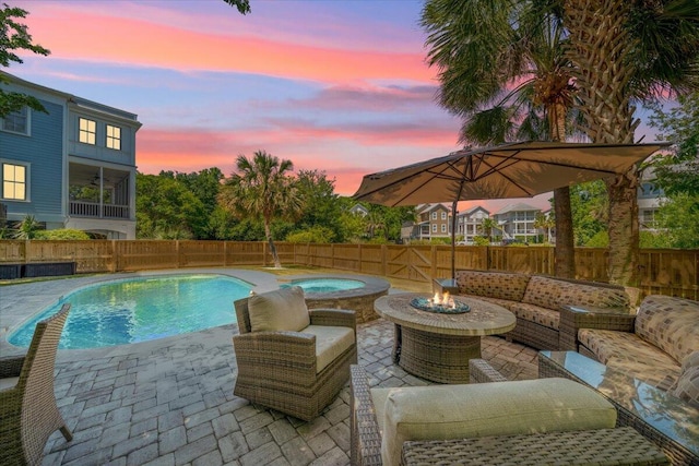764 Post Oak Dr, Mount Pleasant, SC 29464 - pool at dusk with a fenced backyard, a patio, and an outdoor living space with a fire pit