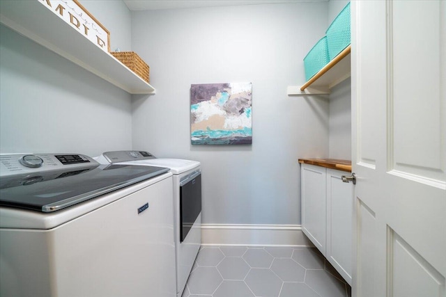 764 Post Oak Dr, Mount Pleasant, SC 29464 - laundry area with separate washer and dryer, tile patterned floors, cabinet space, and baseboards